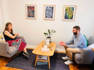 Psychologist and client engaged in a therapeutic conversation in Cova Psychology's consulting room in Melbourne.