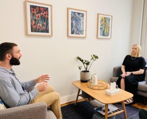 Client and psychologist discussing therapeutic goals in Cova Psychology's comfortable consulting room in Melbourne.