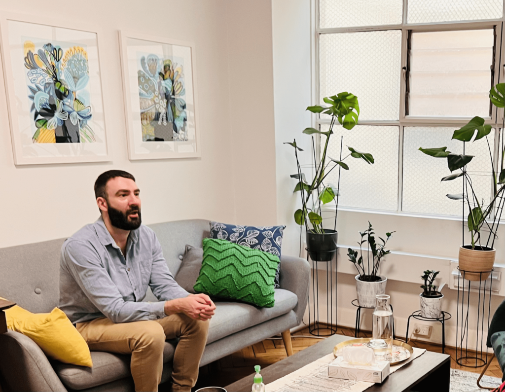 Psychologist in a consulting room at Cova Psychology, offering PTSD and trauma therapy in Melbourne.