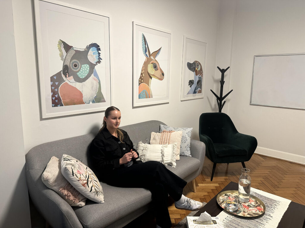 Psychologist sitting in a consultation room at Cova Psychology's Melbourne clinic, offering professional care for clients experiencing depression.