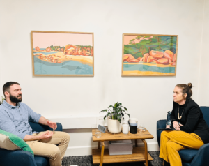 Two psychologists at Cova Psychology in Melbourne engaged in a discussion about mental health, representing our commitment to quality psychologist services.