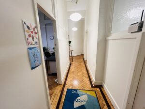 Hallway of Cova Psychology clinic in Melbourne CBD, providing a calm environment for clients seeking support for dissociative disorders with experienced psychologists.